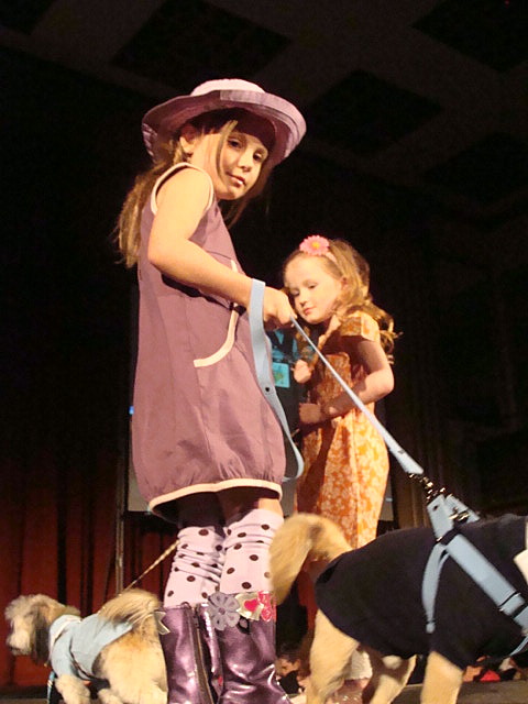 {these twin girls were just too cute on the runway}